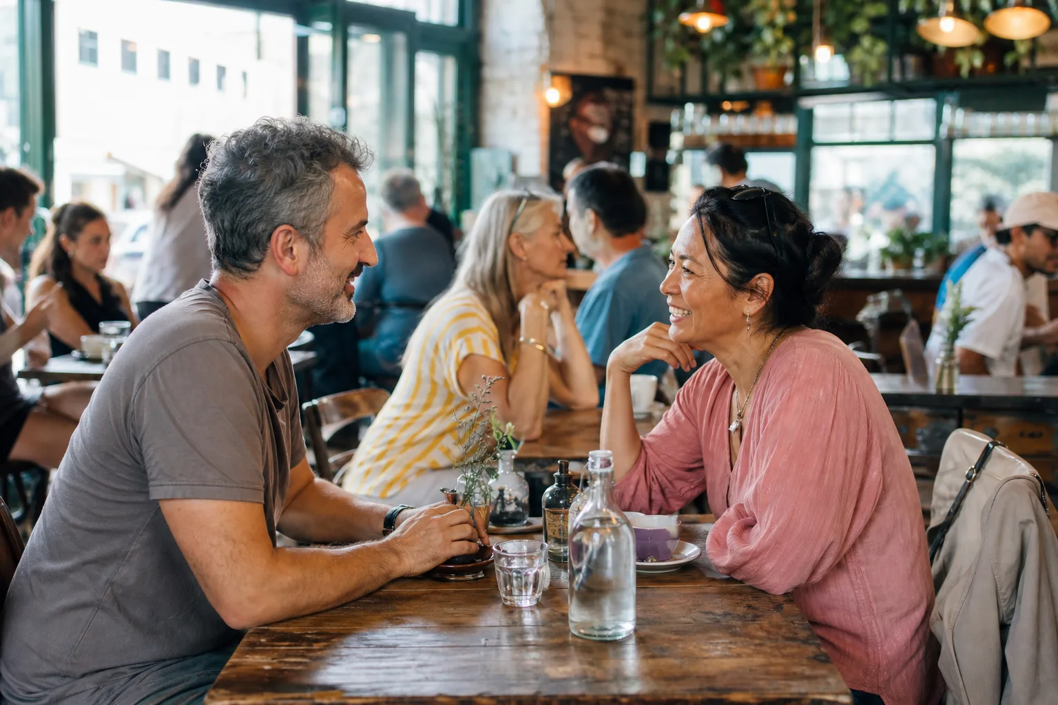 Two people talking over coffee in Worcester city centre